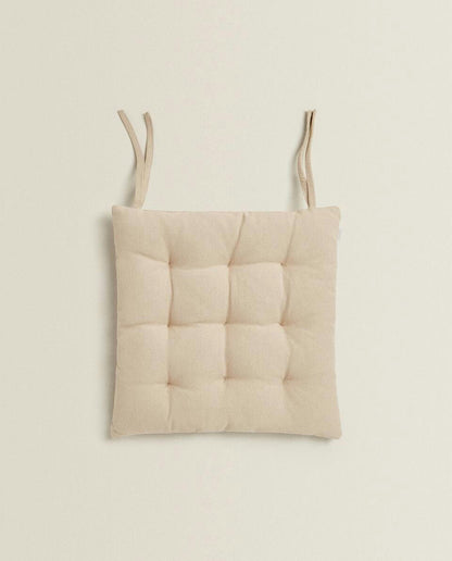 QUILTED CHAIR CUSHION WITH TIES